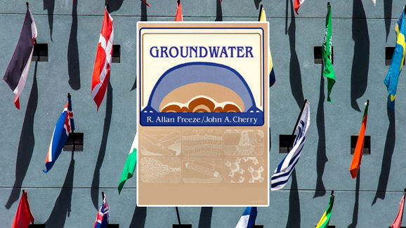 Cover of the book 'Groundwater' by R. Allan Freeze and John A. Cherry, set against a background of various international flags.