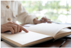 A person reading an agenda